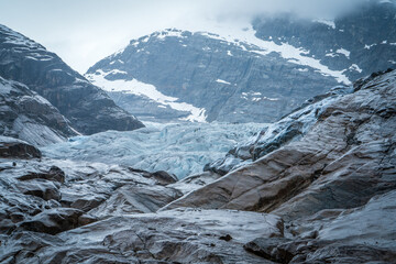Nigardsbreen Glacier with Blue Ice and Rocky Valley in Norway
