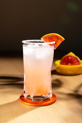 Fototapeta premium Cold grapefruit cocktail in a highball glass.