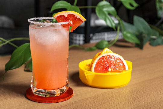 Cold grapefruit cocktail in a highball glass.
