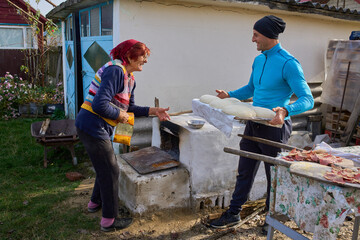 Son presenting bread dough to mother