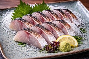 Fresh sashimi slices on serving platter