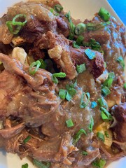 Smoked pork shanks on cheesy grits