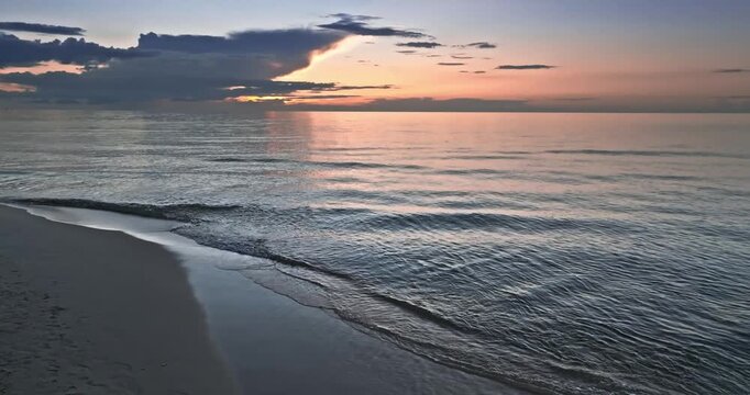 Calm golden sunset over Batlic sea in summer.