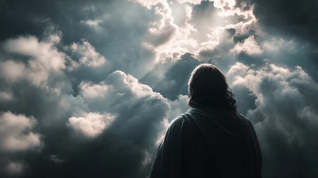 Jesus stands with his back to the viewer under a sky of clouds and light in a powerful moment of reflection and connection