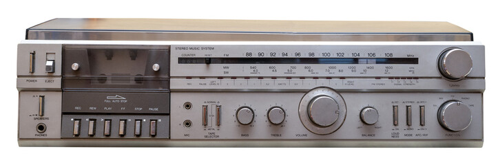 Silver analog hi-fi stereo music system displaying a cassette player and radio tuner © freechoice