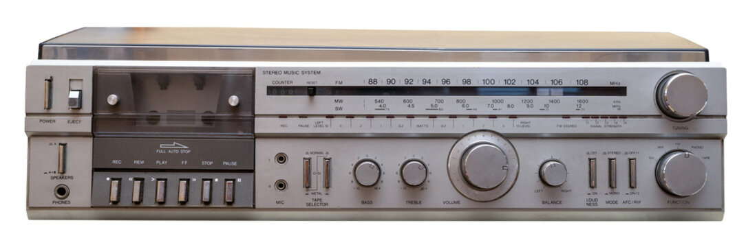 Silver analog hi-fi stereo music system displaying a cassette player and radio tuner