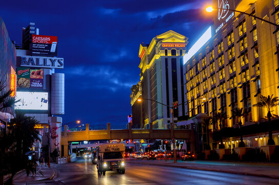 Busy street in Las Vegas at night with lights from hotels casino vehicles on road