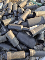 Industrial garbage from black plastic at the landfill