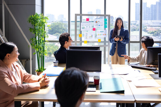 Team of young caucasian entrepreneur have small team meeting for upcoming project for marketing and sale management with skyscraper view for business startup and education