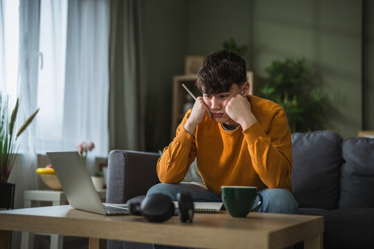 Stressed student experiencing headache during online education and homework