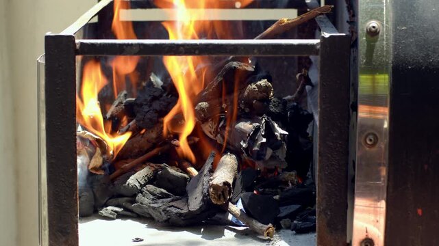 Charcoal catching fire Slowmotion - for Argentine barbecue asado