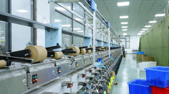 Factory automated production line with roll material conveying and processing equipment in operation