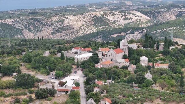 Drone footage showing the Museum of Brac Island, Radojkovic Tower, and St. Helena Church in Skrip village, Croatia.