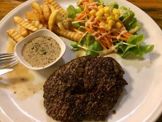  serving of Pepper meat steak with salad and French fried isolated on white background