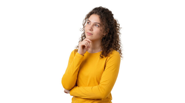 Thoughtful young woman with curly brown hair wearing a bright yellow long sleeve shirt ponders deeply looking upward on transparent background