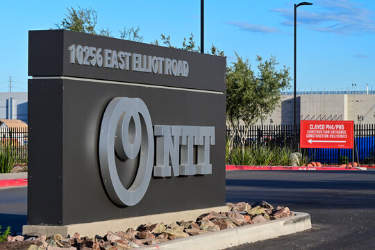 NTT PH1 data center exterior monument sign at corporate campus entrance, representing digital infrastructure branding, hyperscale facility operations, and enterprise technology services