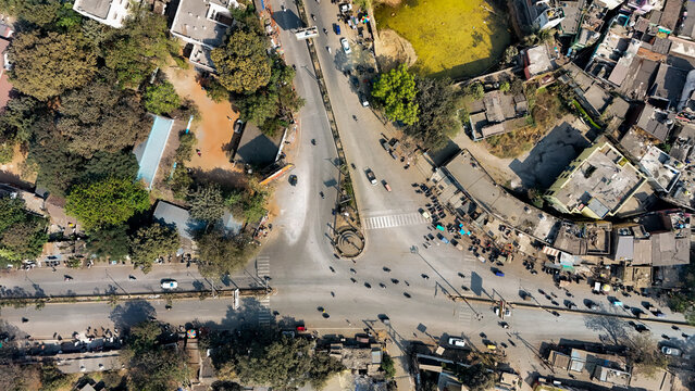 Drone Flying Over Raipur Kalibadi Area, Aerial View Drone Shot of Raipur Kalibadi, Drone Capturing Scenic View of Temple Surroundings, Low Angle Drone in Sky Above Raipur stock photo.