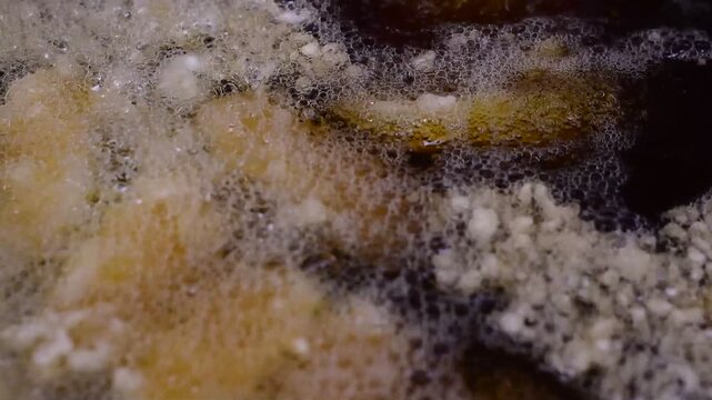 Golden Banana Slices Sizzling in Hot Oil with Crispy Sweet Treat,Banana fritter,The banana and pineapple  fritters are frying in a hot pan