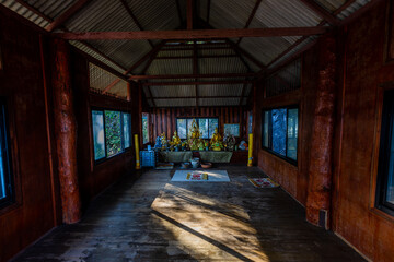 Fototapeta premium Panoramic nature background (mountains, sea, trees, twilight lights in the sky, waterfront communities), naturally blurred through the wind, seen on tourist spots or scenic spots