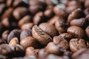 Close up of coffee beans are the background.