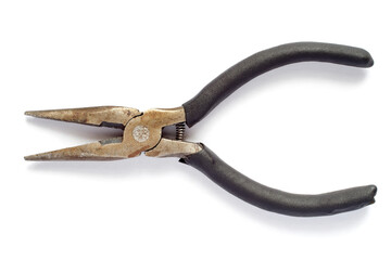 Fototapeta premium Old long pliers with a spring on a white background. Sharp pliers close-up