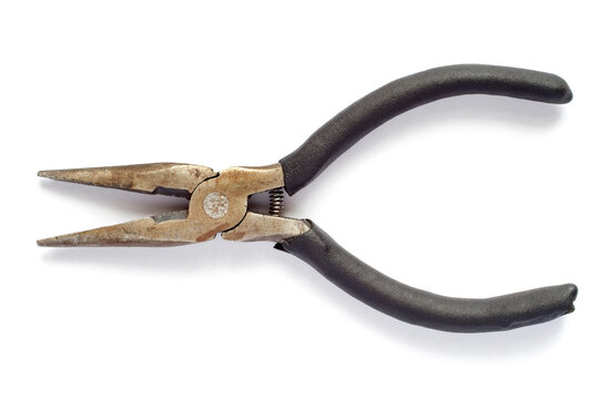 Old long pliers with a spring on a white background. Sharp pliers close-up