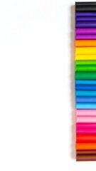 A vertical arrangement of colorful, rectangular art supplies rests against a white background. A variety of shades are shown