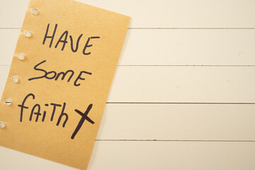 A handwritten note with Have some  faith on it. Positive notes.