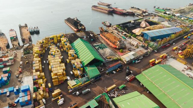 Cinematic drone, cargo containers, barges, warehouses at sunrise, Tondo, Manila