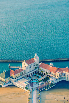 Aerial view of exotic seaside architecture and wedding hall on the blue ocean