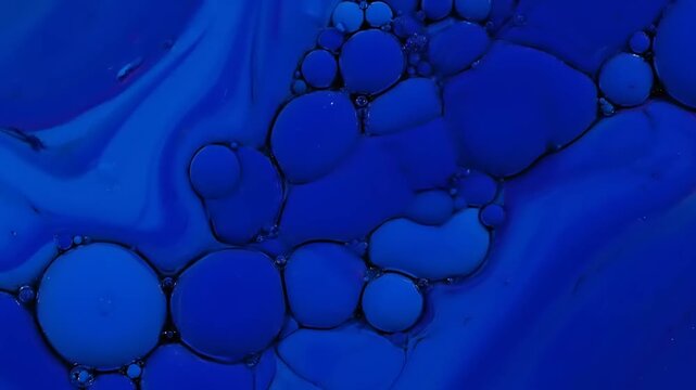 Macro Abstract Action of Blue Oil Bubbles, Liquid Surface, Science Content, Studio Environment, Top View, Fluid Dynamics Concept