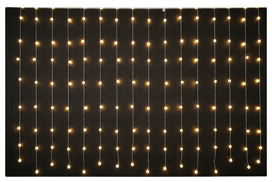 Curtain of hanging warm white string lights on dark wall on a transparent background