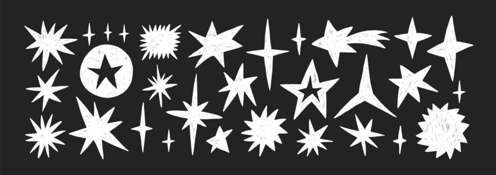 Crayon star, hand drawn pencil or brush doodle illustration. Crayon twinkle, blink, firework, glitter silhouette and glowing symbols on a blackboard.