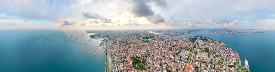 Fototapeta premium Istanbul, Turkey. Sultanahmet Square, Blue Mosque, Hagia Sophia. City center. Fatih District. Bosphorus view. Cloudy weather at sunset. Panorama 360. Aerial view