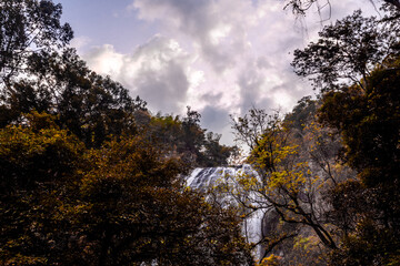 The background of the sea by the evening sea, with natural beauty (sea water, rocks, sky) and fishermen are fishing by the river bank, is a pleasure during travel.