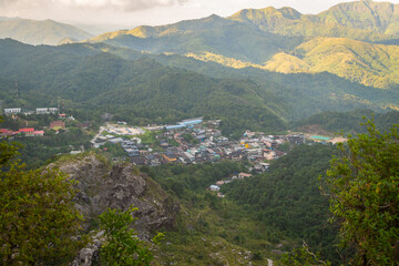 Naklejka premium Panoramic view of the peaceful Pilok village nestled in the lush valleys of Nern Chang Suek, Thong Pha Phum, Kanchanaburi, Thailand