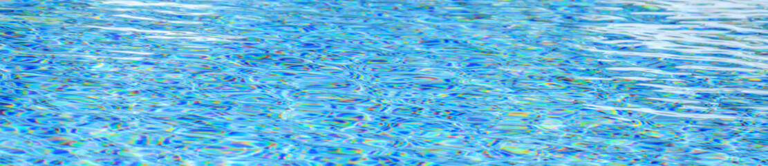 Swimming pool with blue crystal clear water surface and ripple wave background