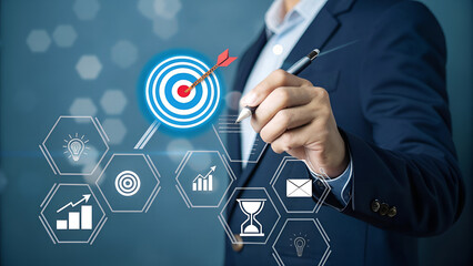Goal setting and strategic focus using digital interface. businessman selecting target icon and strategy dashboard. strategic planning, performance tracking and digital business management