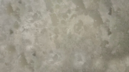 一面がグランジな粒子と不均一でランダムなムラのある模様の抽象的な背景・テクスチャー向け画像素材　JPEG　8K UHDサイズ　ライトグレー・ベージュグレー・ウォームグレー系