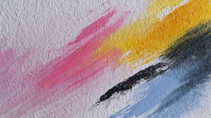 Vibrant abstract brushstrokes blending pink yellow and black on textured wall