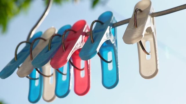 The clothespin swayed in the strong wind.