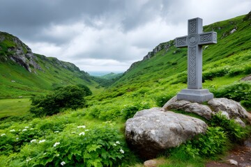 Celtic cross standing in green Irish valley landscape