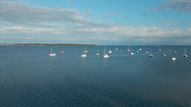 Boats And Yachts Anchored Peacefully In Bay Off Macleay Island Brisbane Australia Drone Track In 4K 60FPS