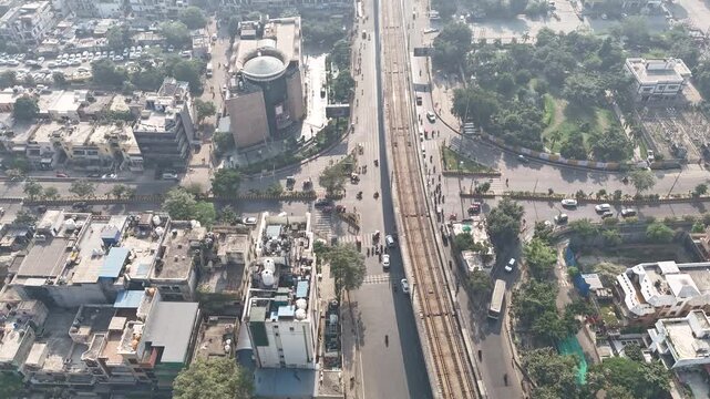 Drone time-lapse footage capturing Noida&rsquo;s expanding skyline and well-planned roadways surrounded by residential and commercial spaces. Evolving skyline and green corridors create great visuals.