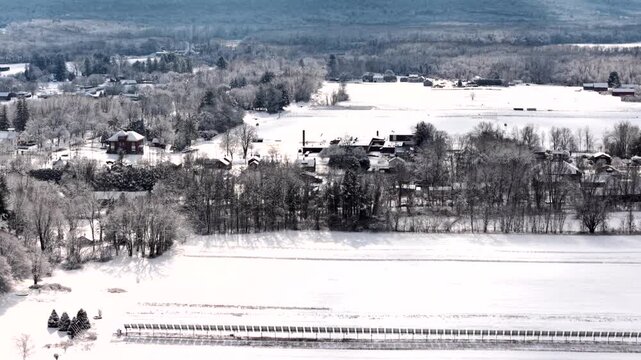 Snowy aerial view of Hadley, MA, capturing serene winter landscape