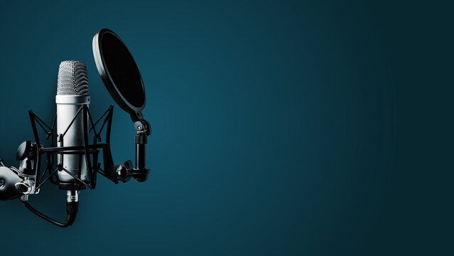 Podcast recording studio setup with a microphone and pop filter on a blue background