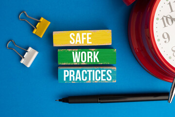 colored wooden block with the words safe work practices