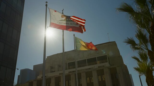 California and USA flag flying in the sky