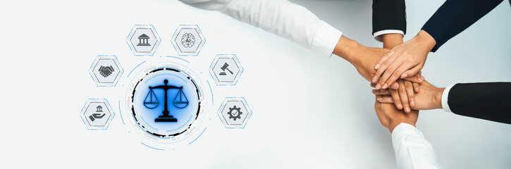 A diverse group unites hands in a symbol of collaboration and justice, emphasizing teamwork in...