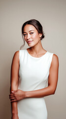 Obraz premium Bride minimalist wedding dress portrait beige background vertical. Young woman elegant sleeveless white gown updo hairstyle, modern simple bridal fashion. Classic sophisticated ceremony preparation.